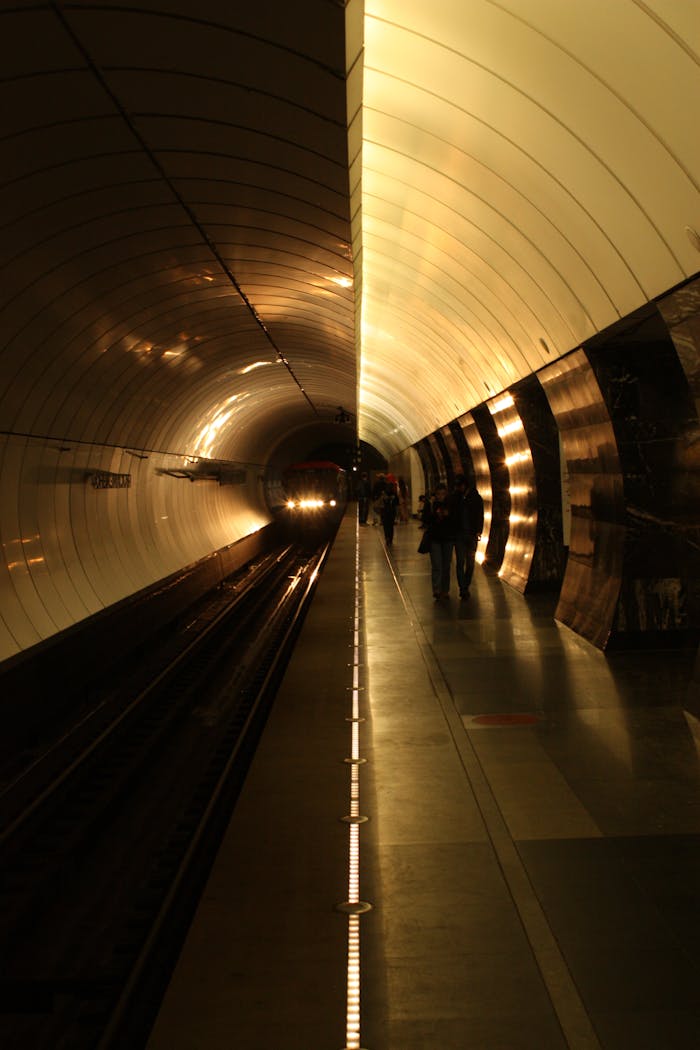 Crafting Captivating Headlines: Your awesome post title goes here Dramatic view of a subway train approaching in a modern station tunnel, highlighting urban transit.