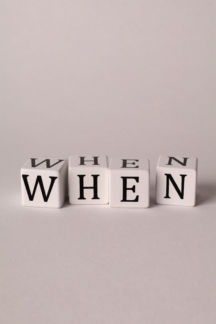 Mastering the First Impression: Your intriguing post title goes here Minimalist close-up of cubes spelling 'When' on a white background.